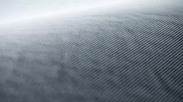 Beautfiul animation of blue fabric waving in slow motion. Close-up detail. 4K Ultra HD 3840x2160 seamless loop.
