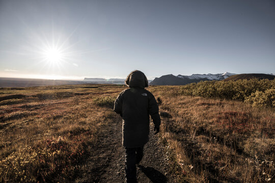 Man walking form behind in nature