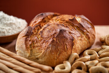 Assortment of bakery products on a wooden table.