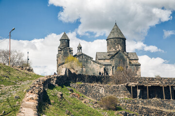 Fototapeta na wymiar Aragatsotn, Armenia, April 7, 2018 - Long shot of 13th-century armenian Tegher monastery and church located on the southeastern slopes of Mount Aragats