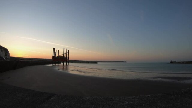 Sunrise time-lapse at Newhaven. Man looking for worms.