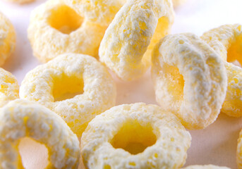 Corn rings on a white background. corn snack.