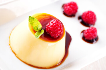 Pudding With Berries and Caramel Sauce. High quality photo