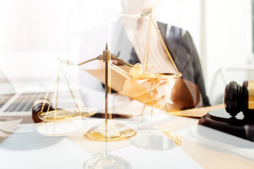 justice and law concept.Male judge in a courtroom on wooden table and Counselor or Male lawyer working in office. Legal law, advice and justice concept.