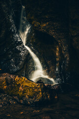 Fototapeta na wymiar Waterfall in nature. Nice long exposure of a waterfall, a river cascading down a rock.