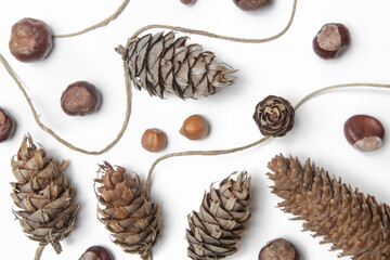 Simple and natural pinecone garland on white. Budget-friendly DIY fall decorating ideas. 