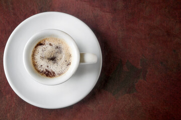 mug of black espresso coffee on a dark background with a place for an inscription