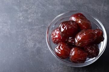 Jujube candied in a beaker on a black background.Free space