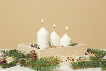 Wooden box christmas centerpiece. Simple and small home decoration with candles in wooden box.
