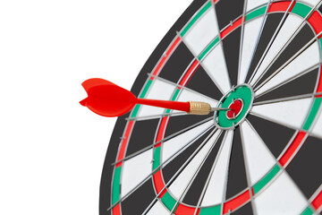Red dart arrow target on center of dartboard isolated on white. Goal, success, business strategy, new year resolution and focus concept. Selective focus