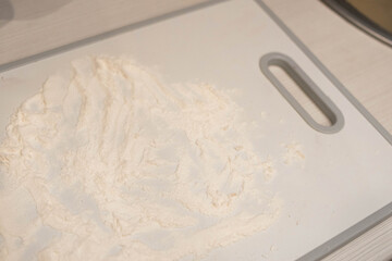 Bakery products. Christmas cookies. Flour on a cutting board. Cooking.