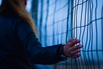 hands behind bars