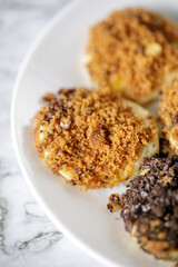 close up shoot of pancakes with peanut topping