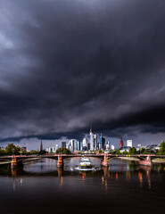 Thunderstorms and storms with weather phenomena over Frankfurt. Clouds over the skyline and the...