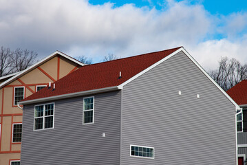 Professionally laid red asphalt shingle rectangular shape on the roof pergola new