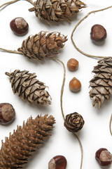 Simple and natural pinecone garland on white. Budget-friendly DIY fall decorating ideas. 