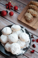 Greek  Christmas cookies kourabiedes with almonds powered with white sugar