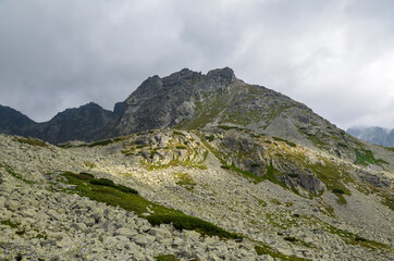 High rocky peaks national park of the High Tatras mountains with mountain Valley and sky with clouds. Slovakia  