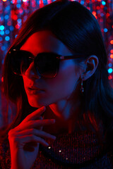 Fashion portrait of young elegant trendy woman in sunglasses.