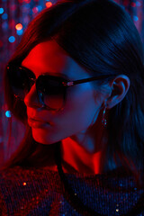 Fashion portrait of young elegant trendy woman in sunglasses.