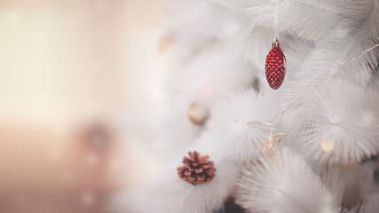 christmas and new year background with white christmas tree and bump toys. horizontal orientation wallpaper with selective focus and bokeh for christmas