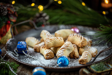Peanut-filled cookies. Festive cookies for the new year, against the background of a Christmas tree and garlands