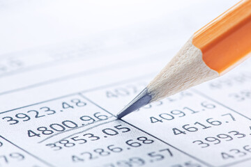 Obraz premium Accounting document with pencil and checking financial chart. Concept of banking, financial report and financial audit.