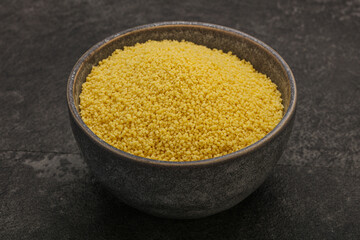 Raw cous cous heap in the bowl