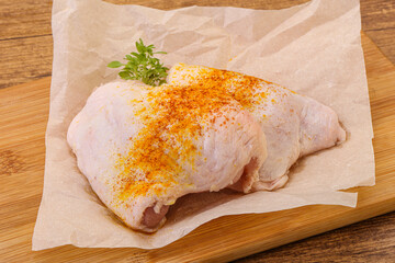 Raw chicken thigh with spices