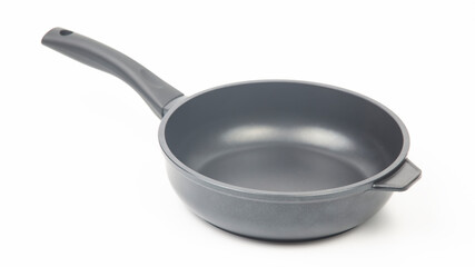 Black frying pan with non-stick teflon coating on white background