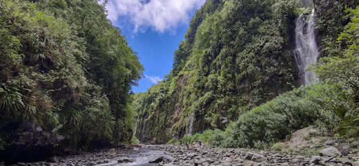 Authentic and not touristic tropical waterfall of volcanic Reunion island, eastern region, Sainte Rose. France.