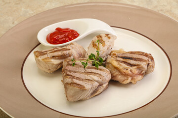 Grilled pork tenderlion with tomato sauce