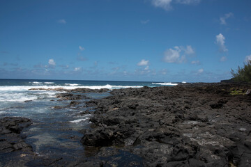 Volcanic shoreline landscape in the tropical Reunion island, more natural eastern region, France,...