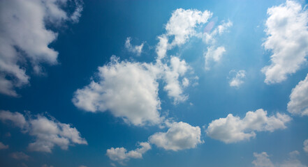 Naklejka na ściany i meble Afternoon cloudy blue sky
