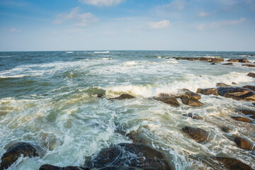 Beautiful seascape during sunrise with motion waves shot with slow shutter at Kovalam, Tamilnadu, India.
