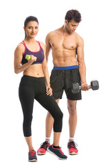 Athletic man and woman with dumbbells on the white background