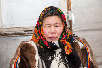 woman in the national winter clothes of the northern inhabitants of the tundra, the Arctic circle