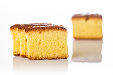 Butter cake sliced on white background