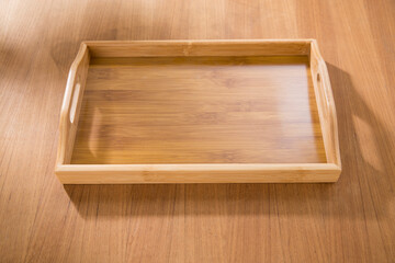wooden tray on wooden table.