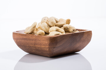 Plate of cashews on a white background