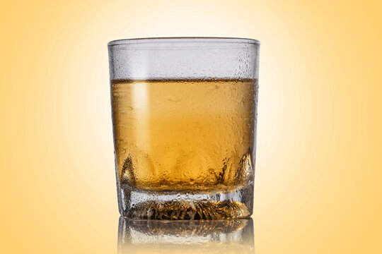 Glass of whiskey in studio shoot.