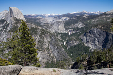 Amazing view of famous Yosemite Valley with rocks and river on a beautiful sunny day with blue sky in summer, Yosemite National Park, California, USA
