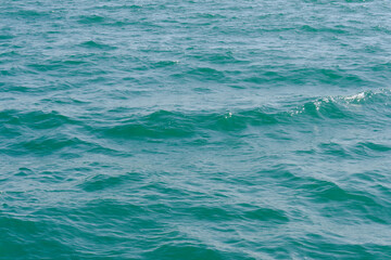 Fototapeta premium sea wave close up. Ripple on the surface background