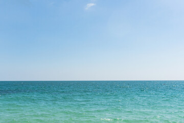 Fototapeta na wymiar Sea waves and blue sky on sunny day background. copy space