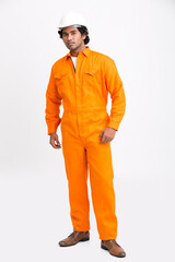 Indian municipal young worker standing with safety helmet on white background.