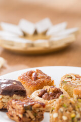 Plates of Oriental sweets on table.