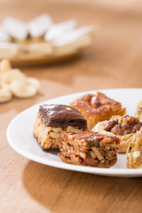 Plates of Oriental sweets on table.