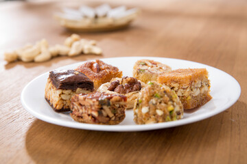 Plates of Oriental sweets on table.