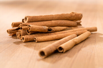 cinnamon sticks on wooden table.