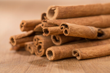 cinnamon sticks on wooden table.